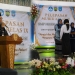 Kepala sekolah SMPN 1 Bangsri memberikan sambutan dalam acara pelepasan siswa kelas IX tahun ajaran 2025 2026 di Gedung PGRI Bangsri