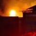 Jepara terbakar, petugas Damkar memadamkan kebakaran gudang meubel di Desa Suwawal Barat, Kecamatan Mlonggo, Senin (27/7/2026).